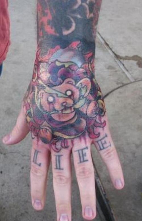 Nice teddy bear hand tattoo