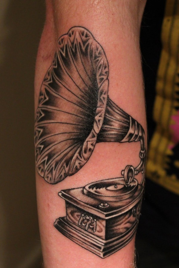 Old gramophone arm tattoo