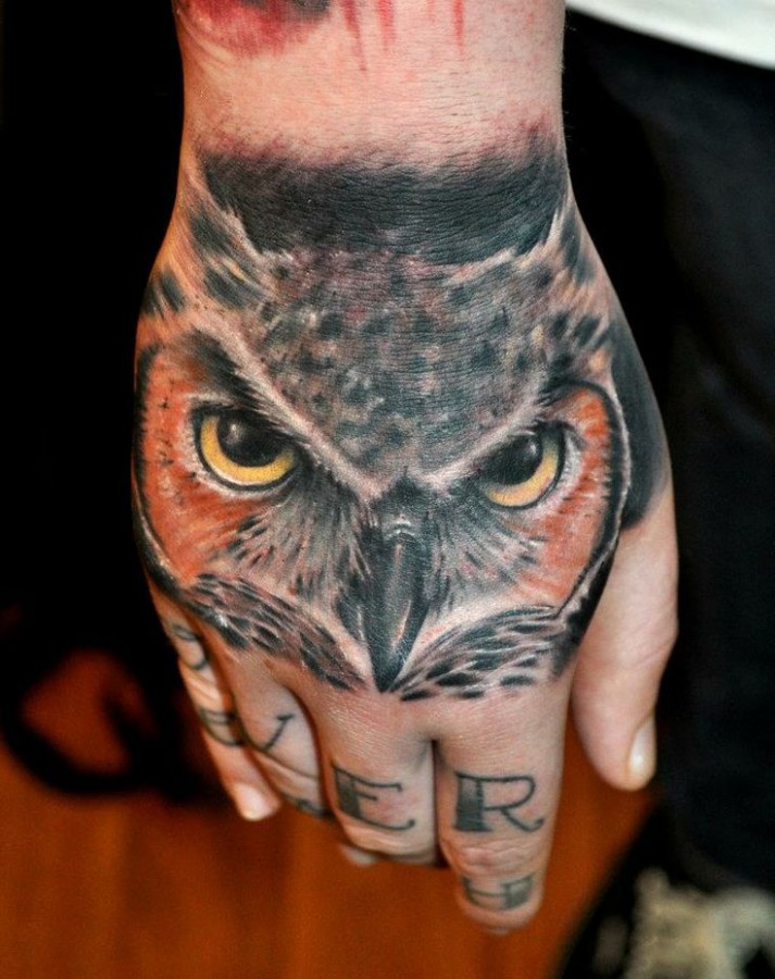 Owl hand tattoo by Benjamin Laukis