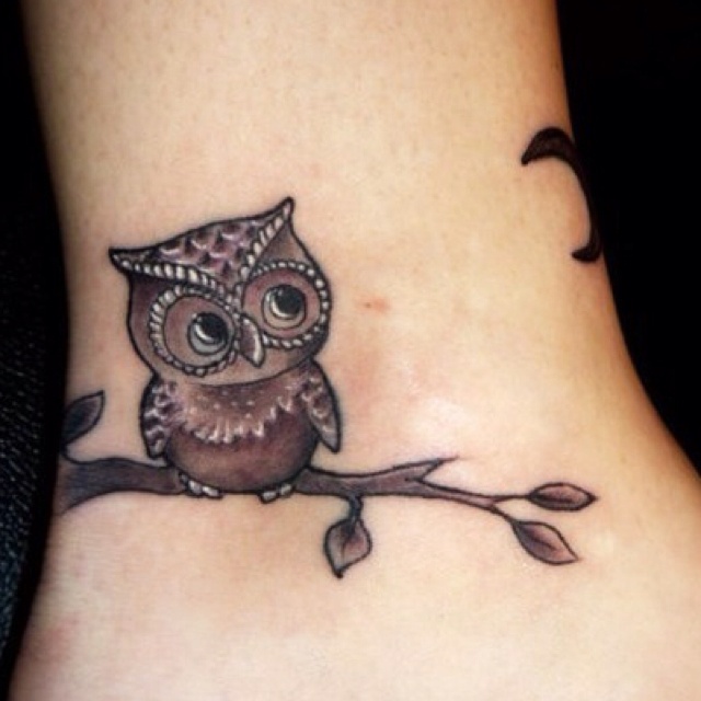 Owl on a branch tattoo