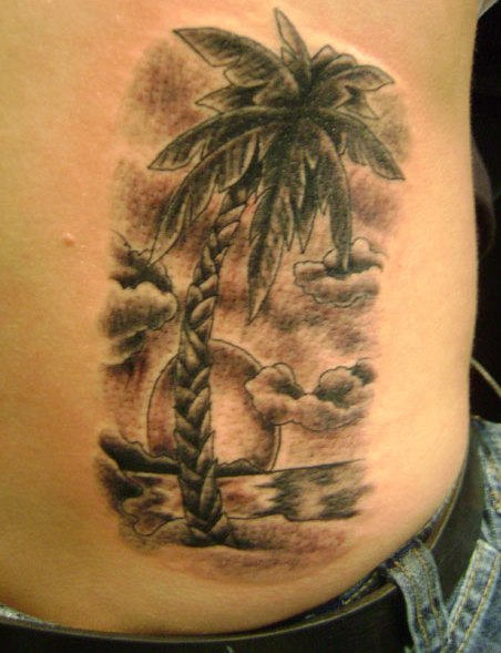 Palm tree and sunset tattoo