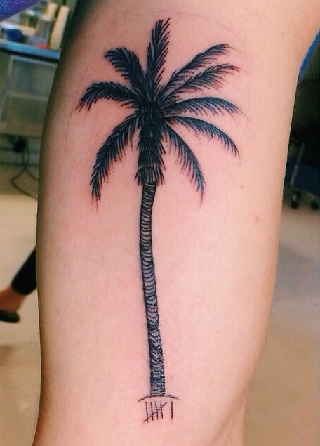 Palm tree leg tattoo