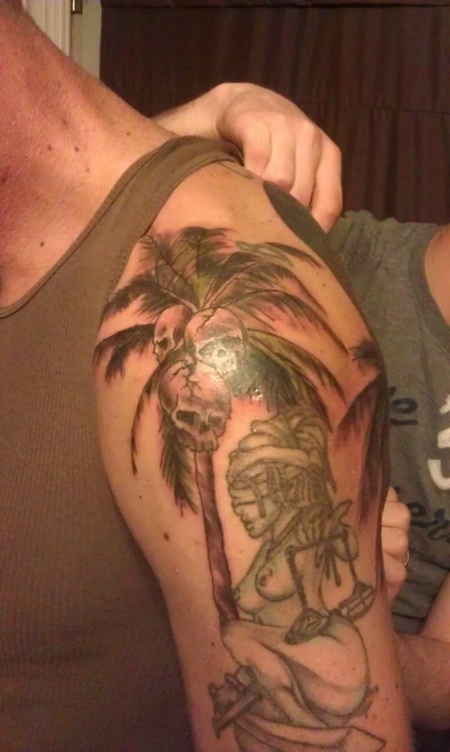 Palm tree with skulls tattoo