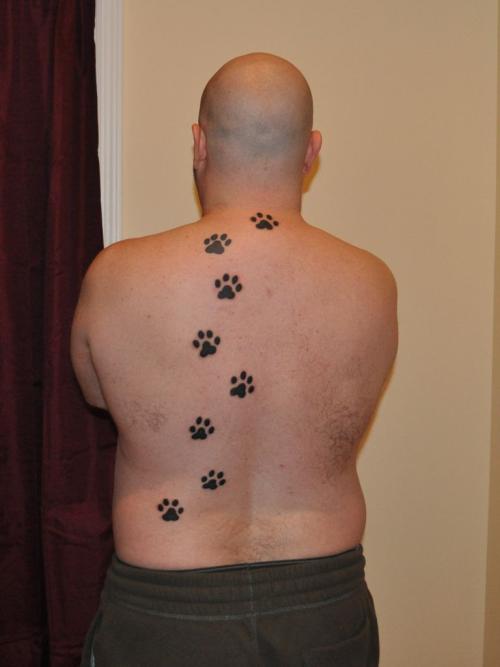 Paw print tattoo on back