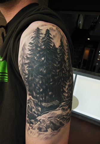 Pine trees arm tattoo