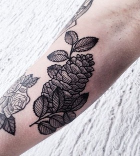 Pinecone tattoo on arm