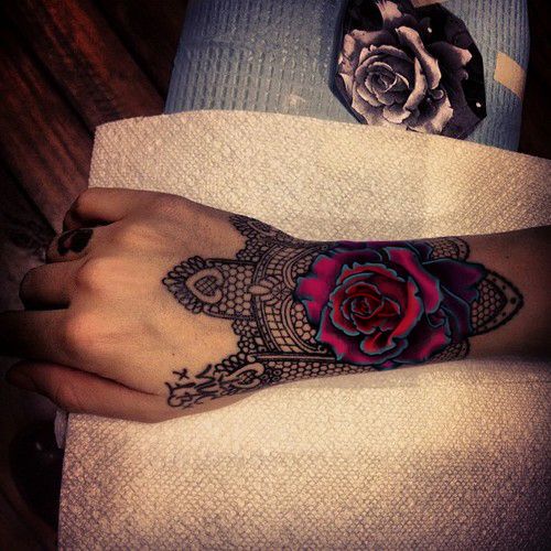 Pink bright flower rose and black lace tattoo