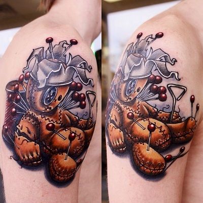 Pinned voodoo doll tattoo