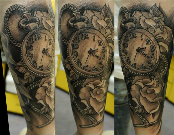 Pocket watch and flowers tattoo