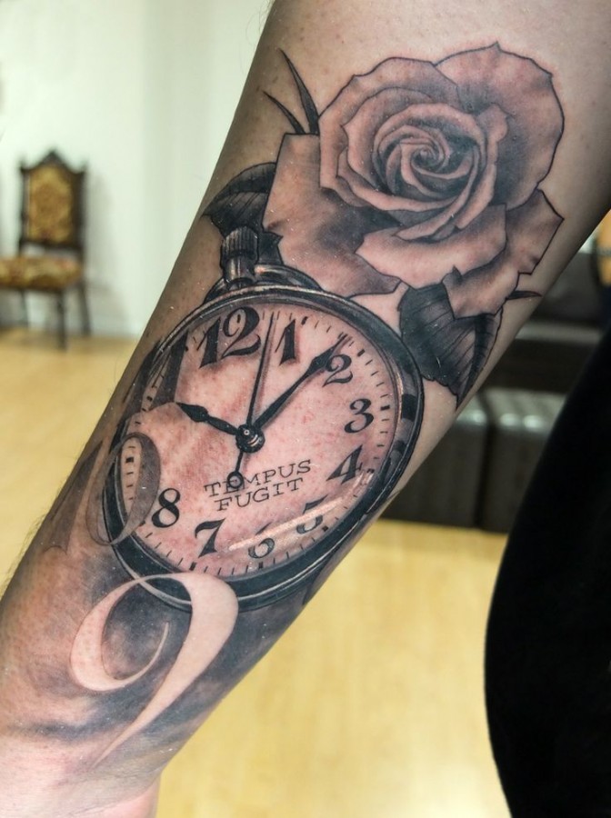 Pocket watch and rose tattoo by Xavier Garcia Boix