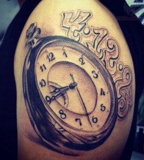 Pocket watch tattoo on arm