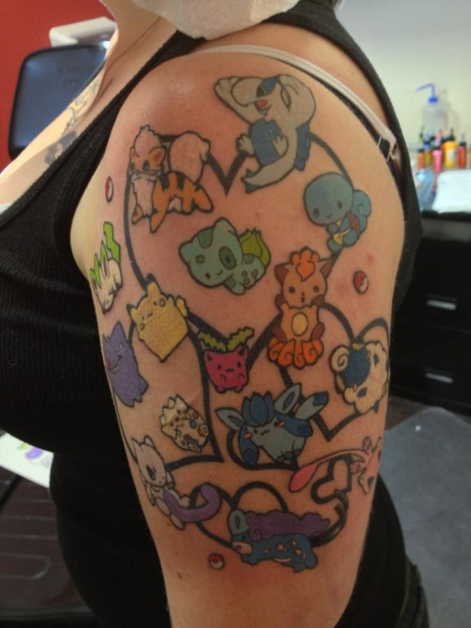 Pokemon characters arm tattoo