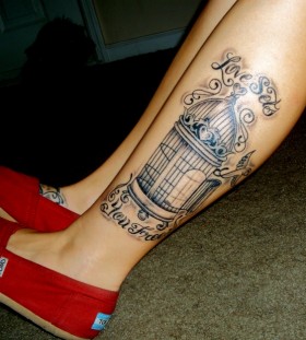 Pretty birdcage leg tattoo