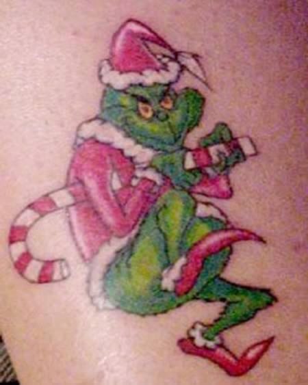 Pretty green grinch christmas tattoo