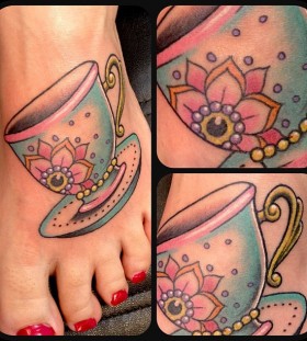 Pretty teacup foot tattoo