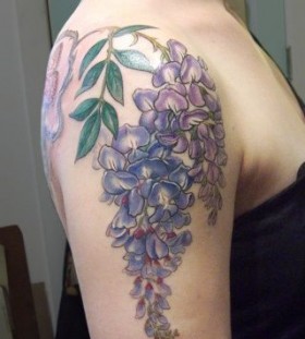 Purple flowers tattoo by Esther Garcia