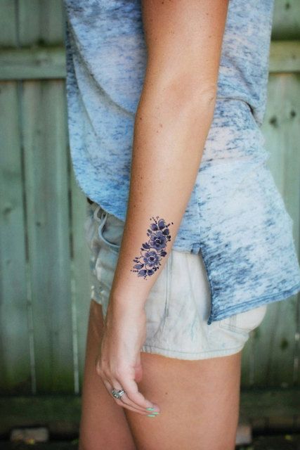 Purple flowers wrist tattoo