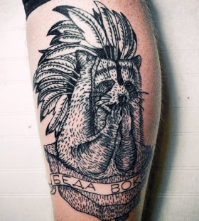 Raccoon with feather hat tattoo