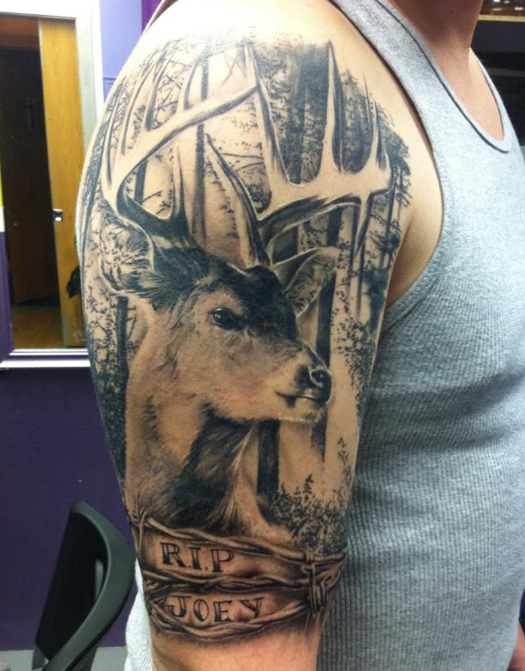 Realistic deer and trees tattoo