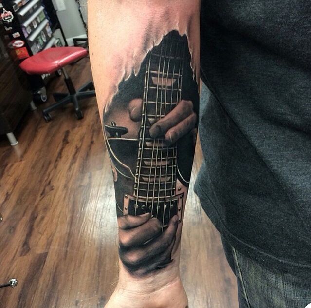 Realistic guitar tattoo by Kyle Cotterman