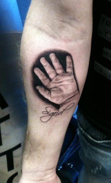 Realistic hand tattoo by Ellen Westholm