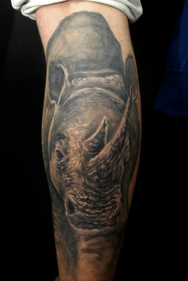 Realistic rhino leg tattoo