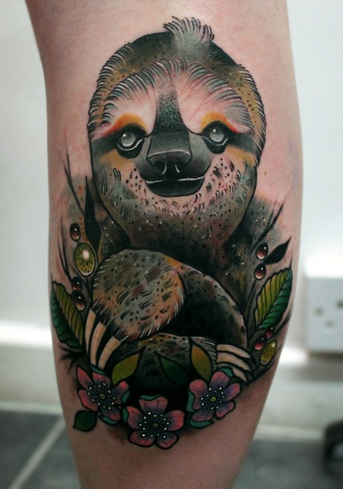 Realistic sloth and flowers tattoo