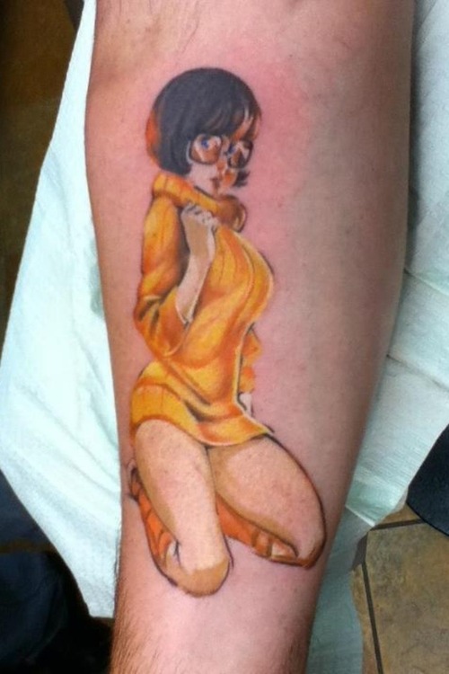 Realistic velma arm tattoo