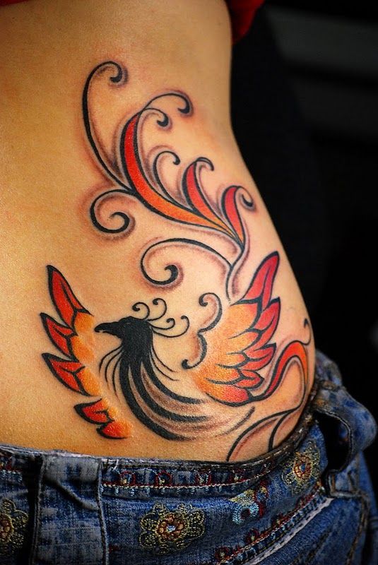 Red and black tribal bird tattoo