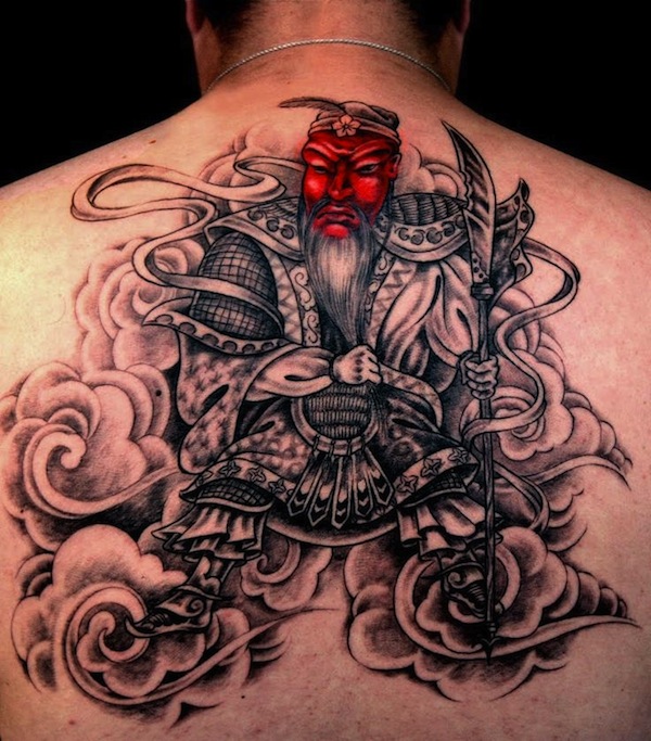 Red face samurai back tattoo