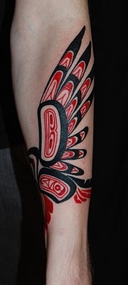 Red feather and tribal bird tattoo