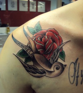 Red rose and swallow tattoo