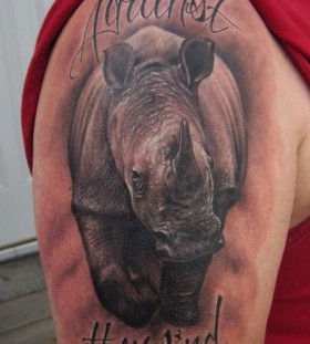 Rhino and quote tattoo