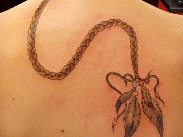 Rope and feathers back tattoo