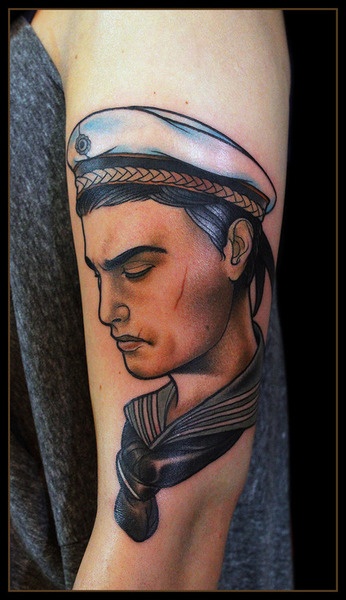 Sad sailor arm tattoo