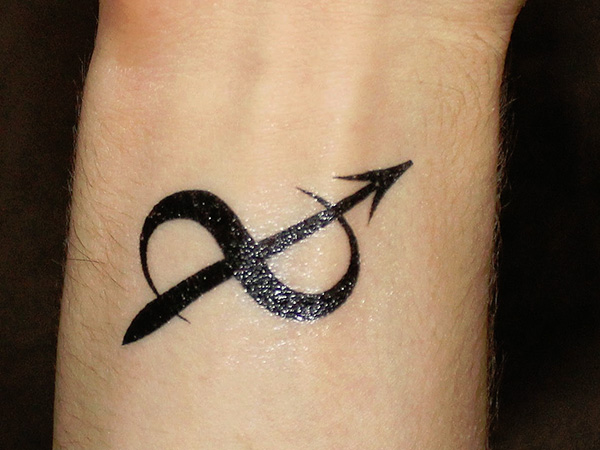 Sagittarius symbol wrist tattoo