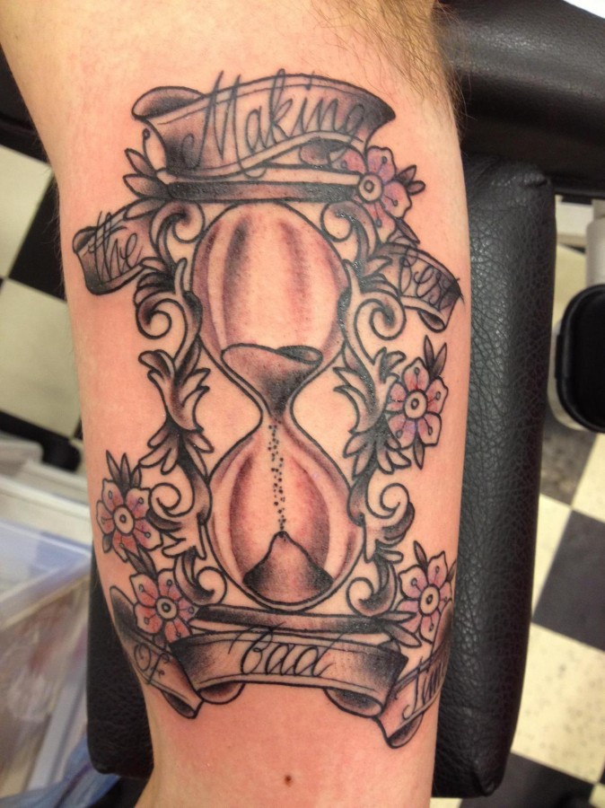 Sand clock and flowers tattoo