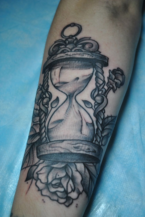 Sand clock and rose tattoo