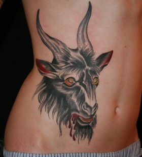 Scary bloody goat tattoo