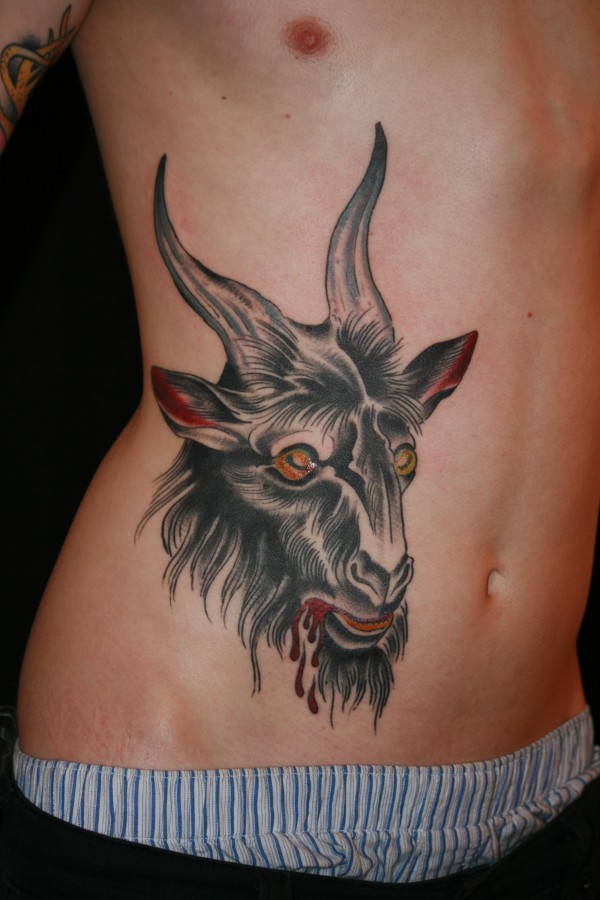 Scary bloody goat tattoo