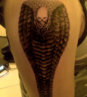 Scary cobra arm tattoo