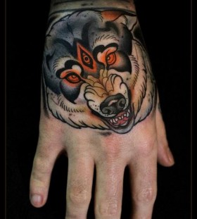 Scary wolf hand tattoo