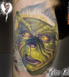 Simle looking grinch christmas tattoo
