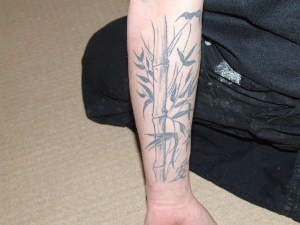 Simple bamboo arm tattoo