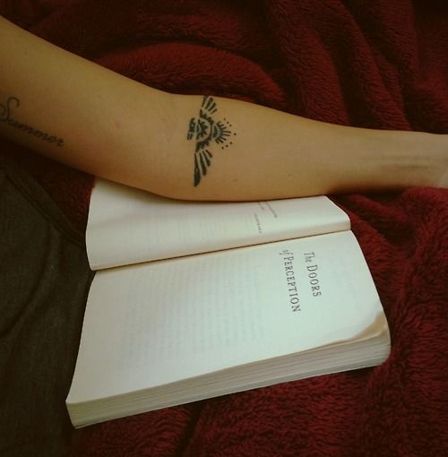 Simple book and tribal bird tattoo