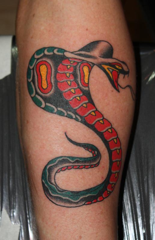 Simple coloured cobra tattoo