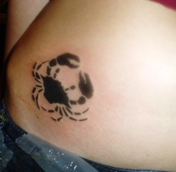 Simple crab hip tattoo