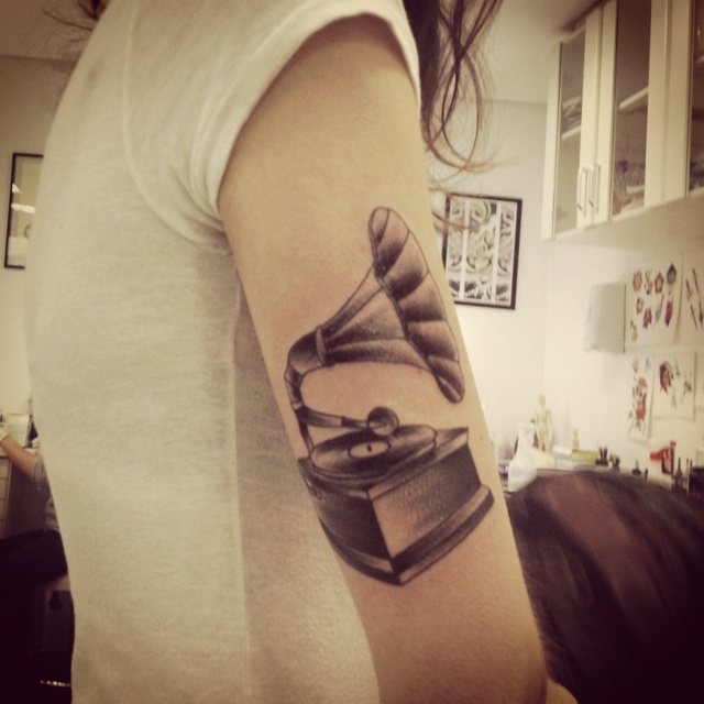 Simple gramophone arm tattoo