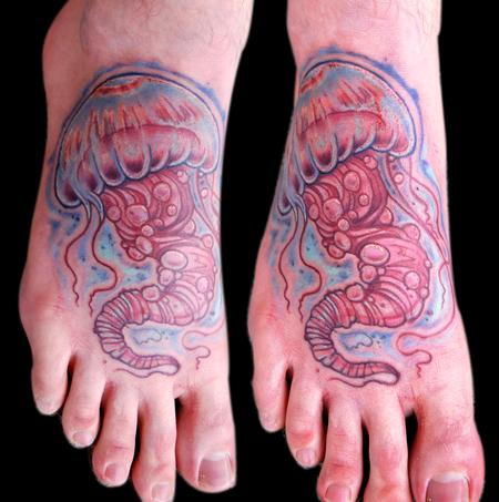 Simple jellyfish foot tattoo