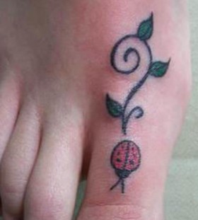 Simple ladybug foot tattoo